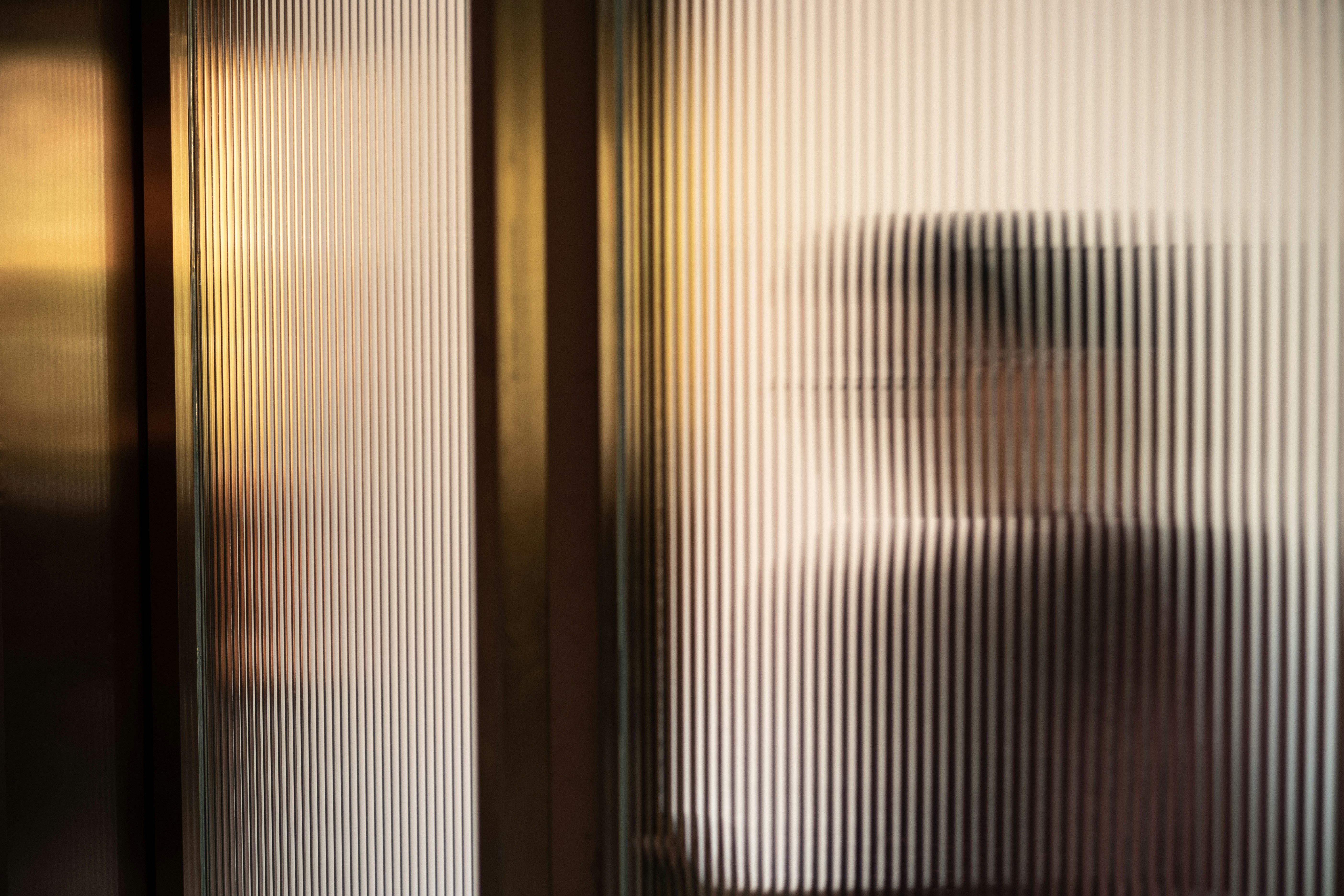 Worker on a job site in heavy shadow, illustrating a surveillance pricing guide