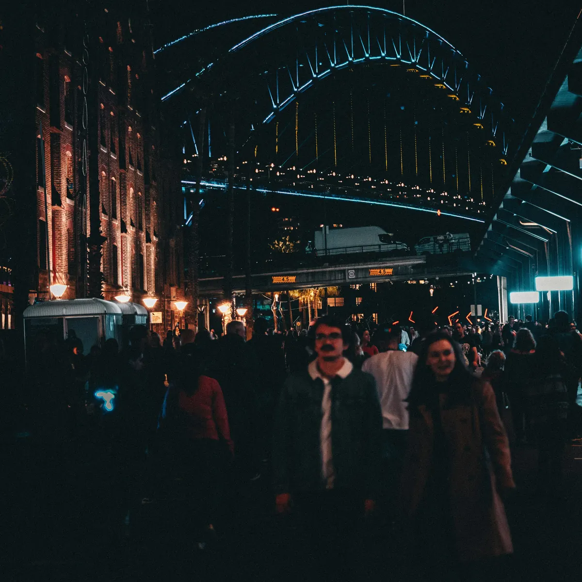 Crowds at night with the Sydney Harbour Bridge in the background
