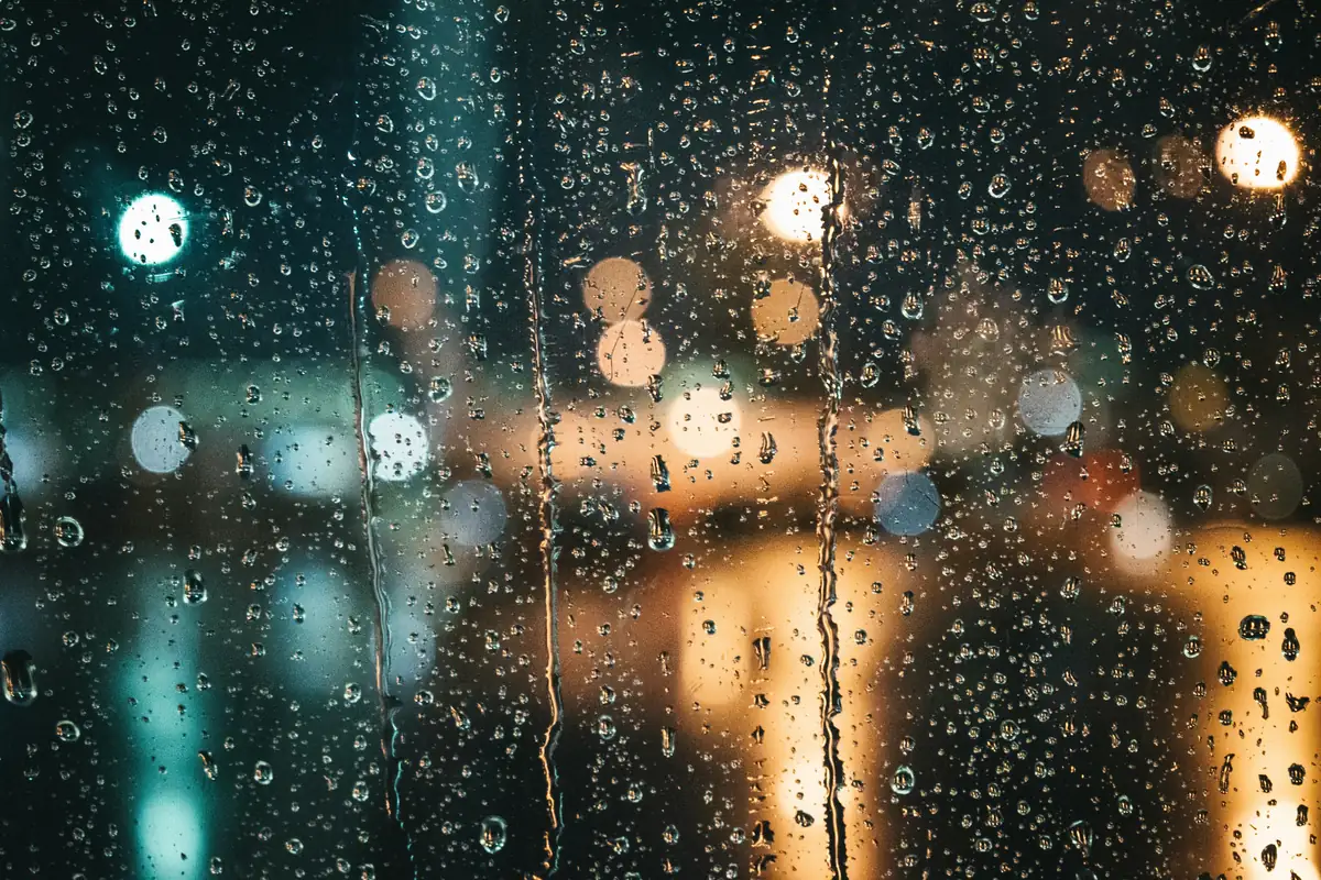 Rain on a car window at night, the waiting side of surveillance work